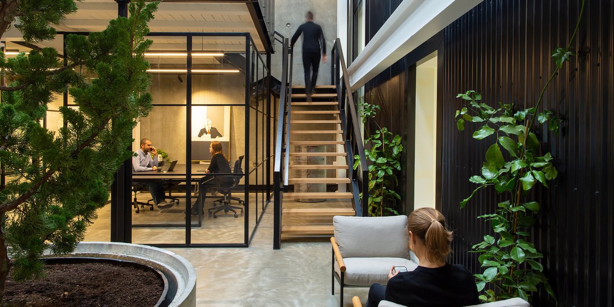 Man ascending interior staircase