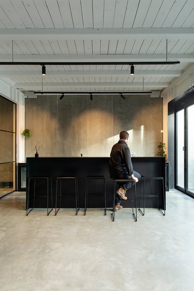 Man seated on bar stool