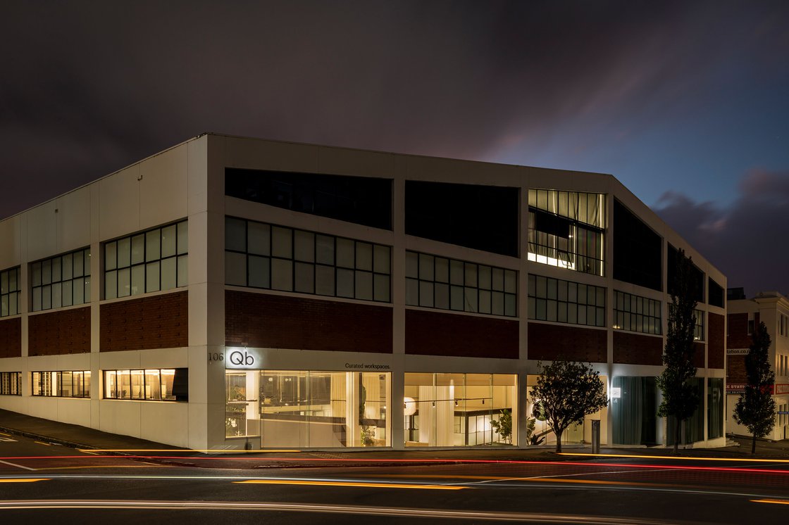 Exterior of Qb Parnell at night with illuminated signage