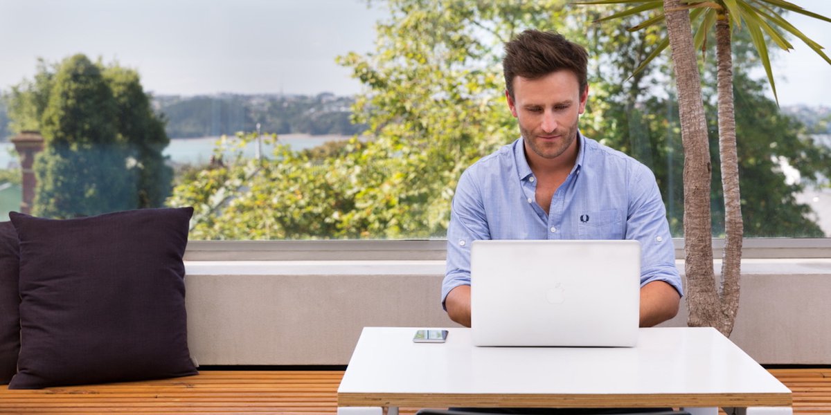 Man working outside at a computer